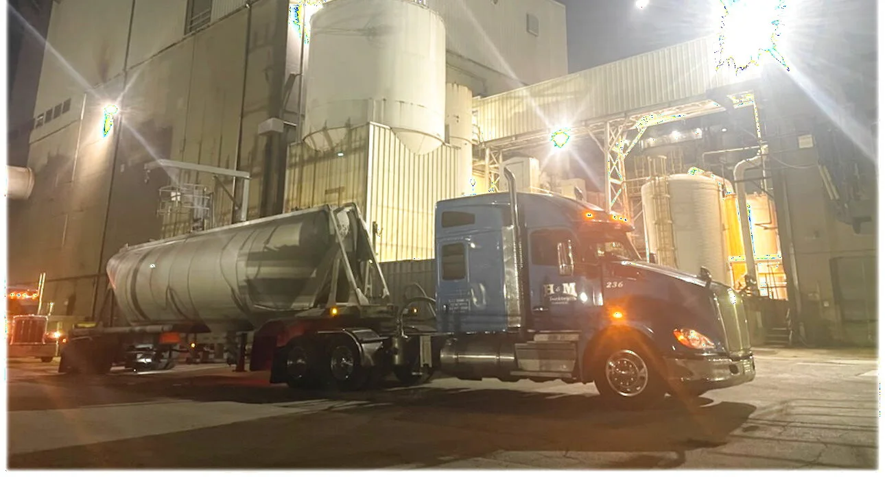 H&M tractor and dry bulk pneumatic trailer at a plant