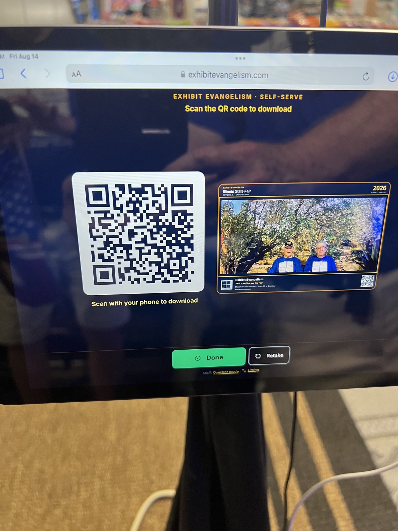 Self-serve iPad showing QR download after a framed capture
